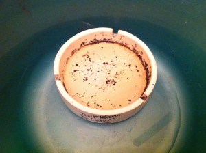 an ashtray soaking in a basin