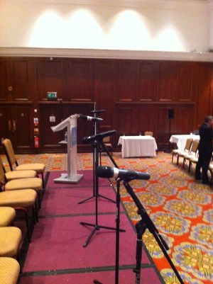 a group of microphones on a stage