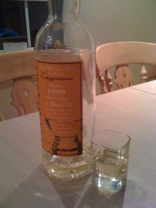 a bottle of whiskey and a shot glass