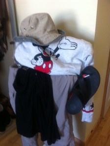 Blue crocs, checked short-sleevd shirt (Craghoppers), black cotton cropped trousers, lightweight green jumper (Warehouse)